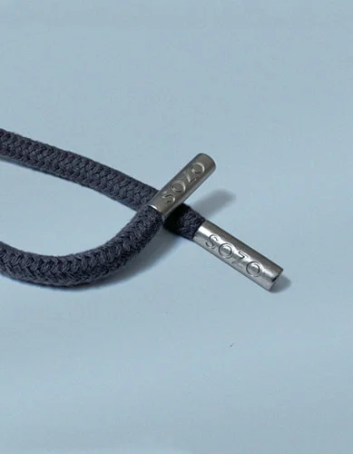 Branded cord ends and toggles for clothing.