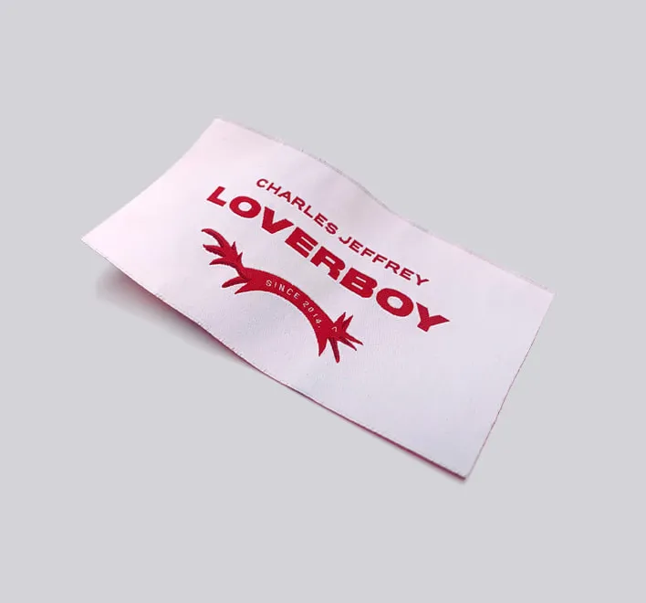 White woven label for clothing brand.