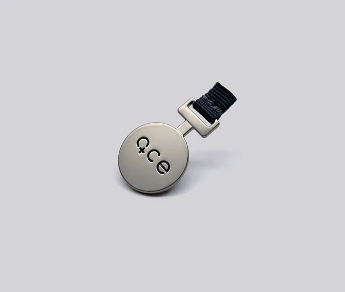 Engraved metal tab with grosgrain ribbon