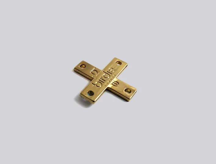 Engraved gold metal sew-on tags