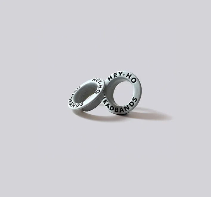 Custom branded eyelets with colour infill.
