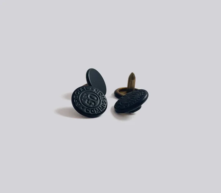 Matt black brass rivets.