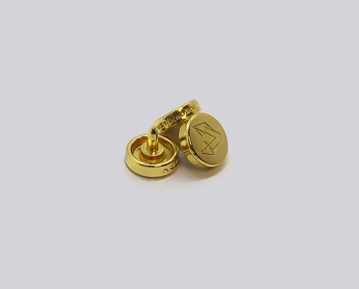 Die-cast custom rivet in polished gold finish.