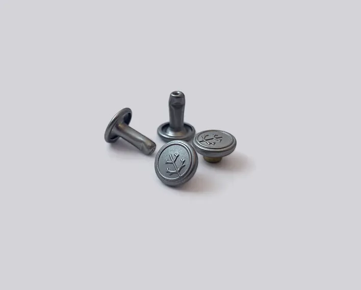 Brass capped branded rivet embossed logo.