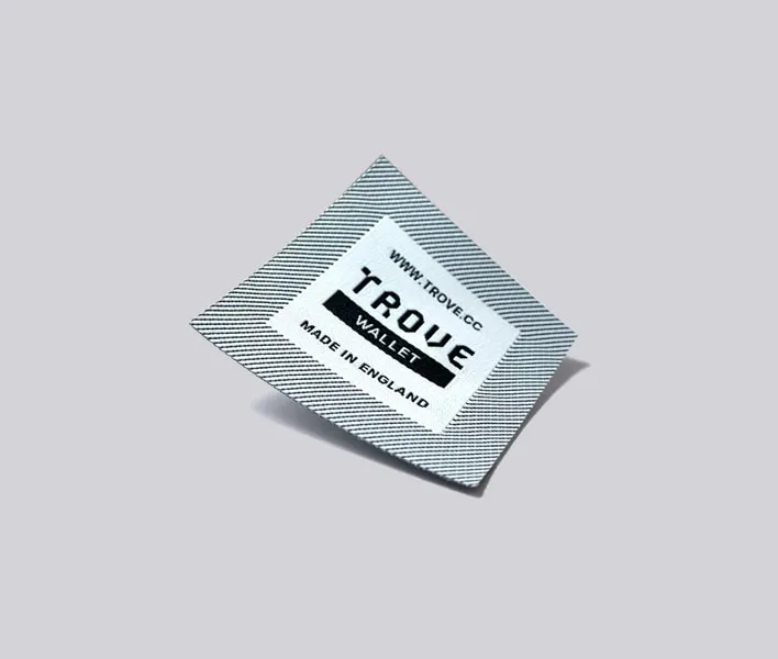 Woven brand label black and white.